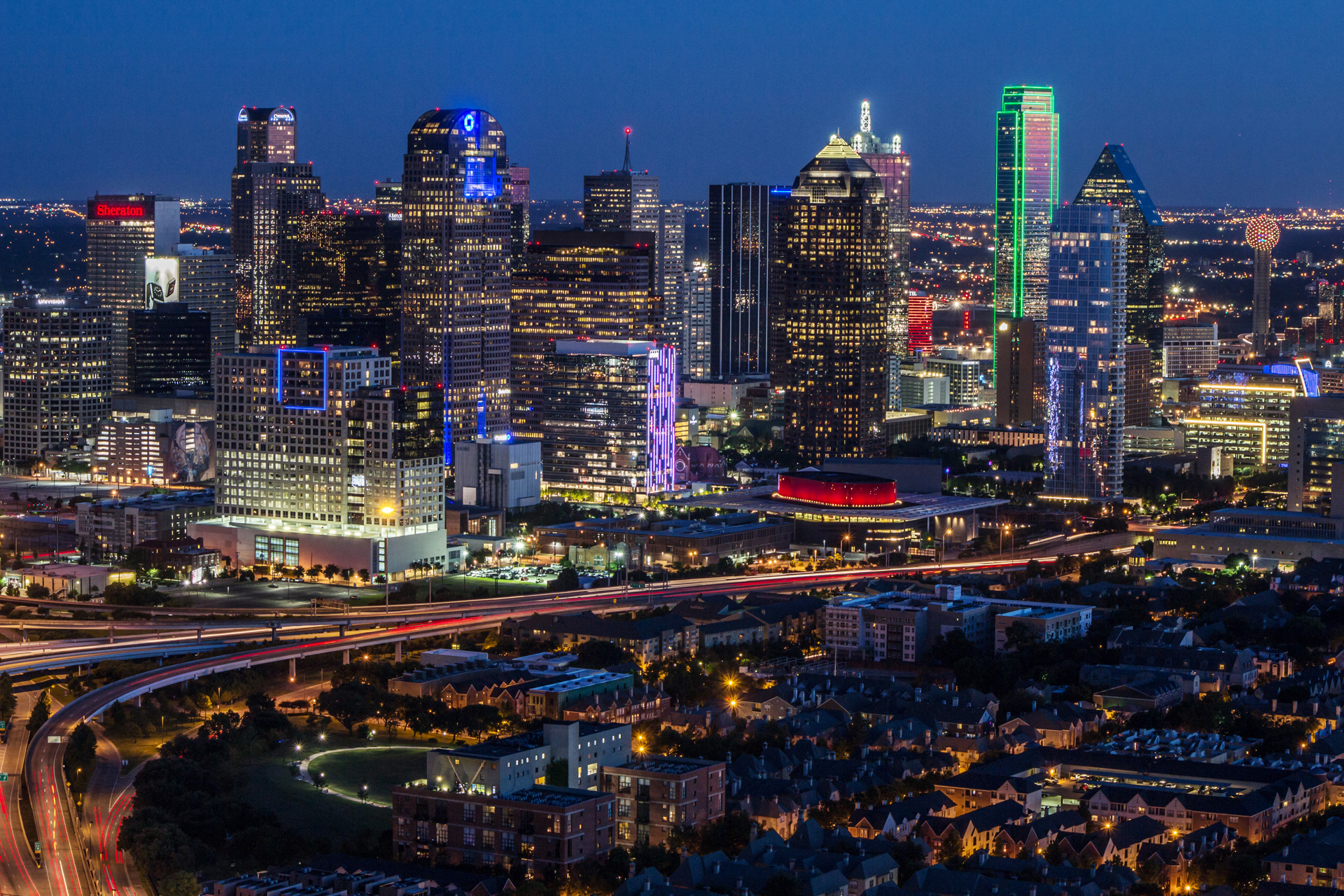 A skyview of the Dallas City Arts District at night time.